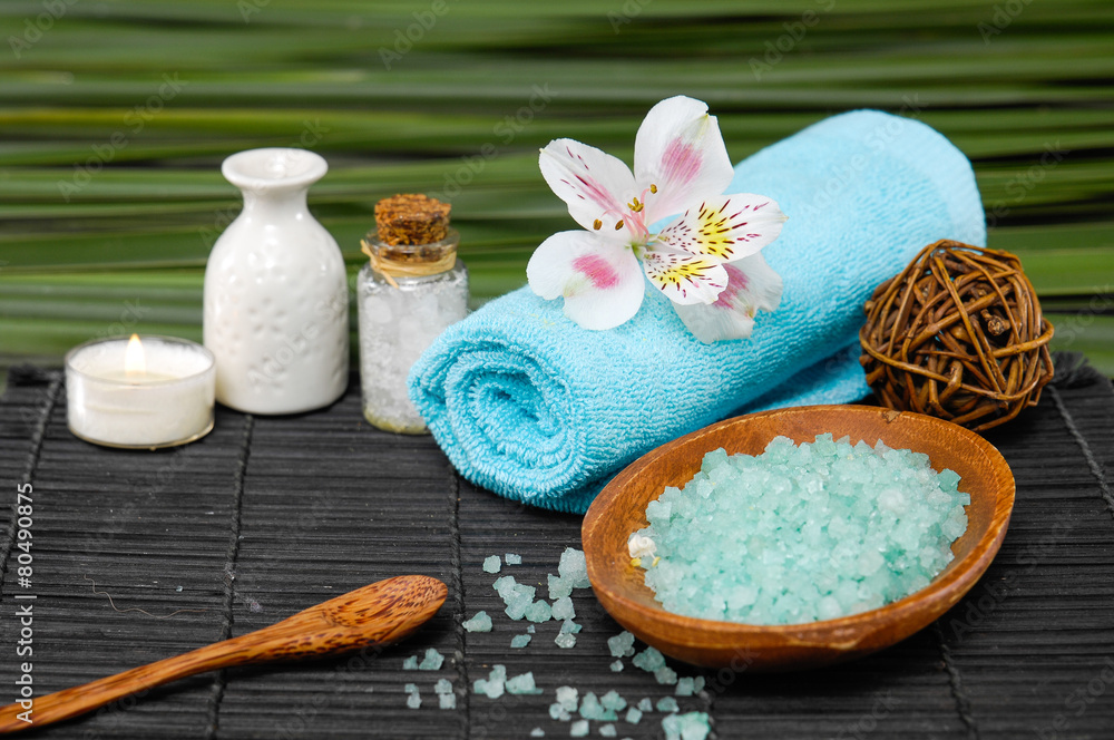 Spa set on mat with green plant Spa set on mat with green plant