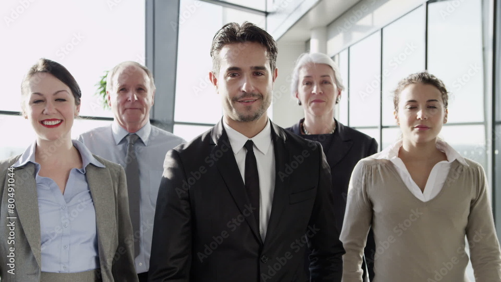 Attractive diverse business team in a light modern office building Attractive diverse business team in a light modern office building