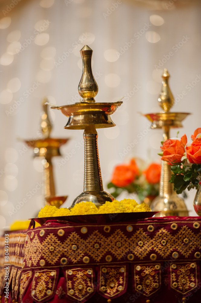 Obraz premium Vilakku lamps used as decorations at a Hindu Indian wedding