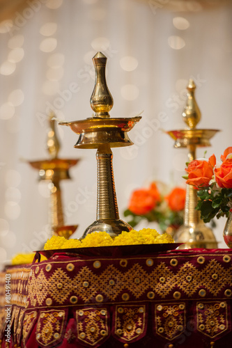 Vilakku lamps used as decorations at a Hindu Indian wedding