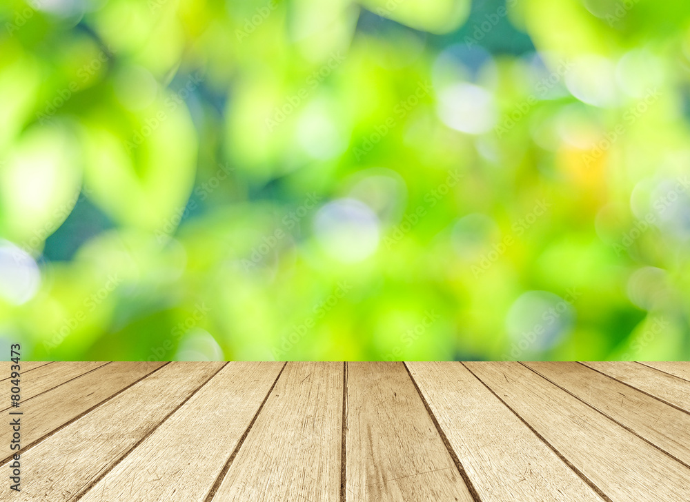 Perspective wood over blur trees with bokeh background Perspective wood over blur trees with bokeh background