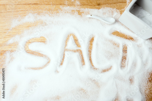 words SALT handwritten on salt