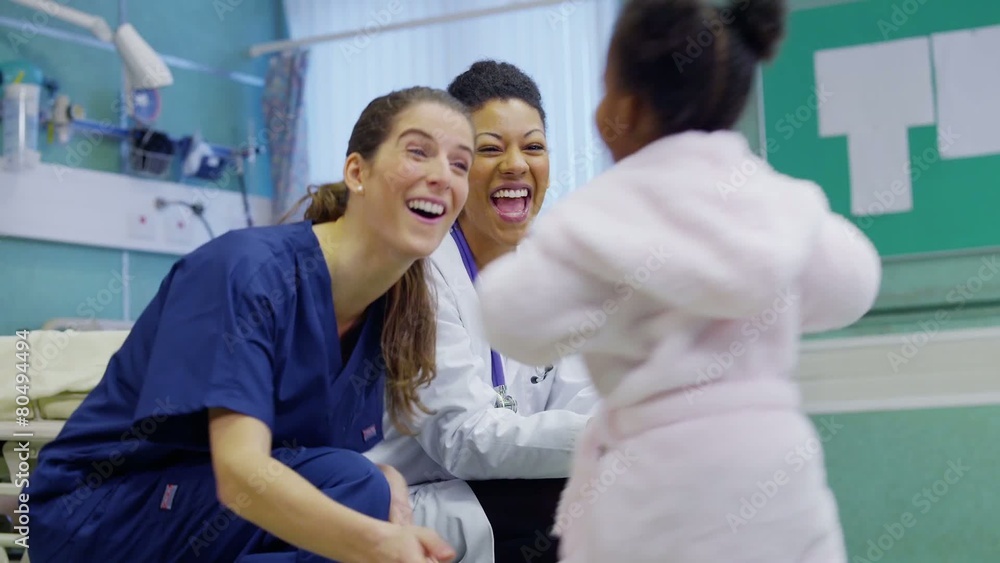 Cute and affectionate little girl in hospital takes steps towards the doctor Cute and affectionate little girl in hospital takes steps towards the doctor
