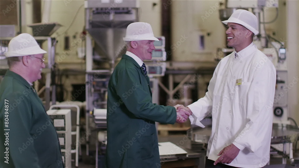 Businessmen in the food and drink industry meet and shake hands Businessmen in the food and drink industry meet and shake hands