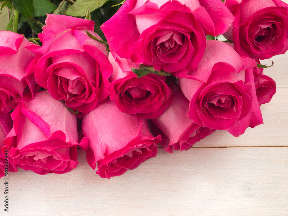 Heap of pink roses on the planks background Heap of pink roses on the planks background
