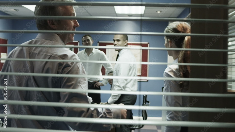 Multi ethnic business group are called into the office for a team meeting Multi ethnic business group are called into the office for a team meeting
