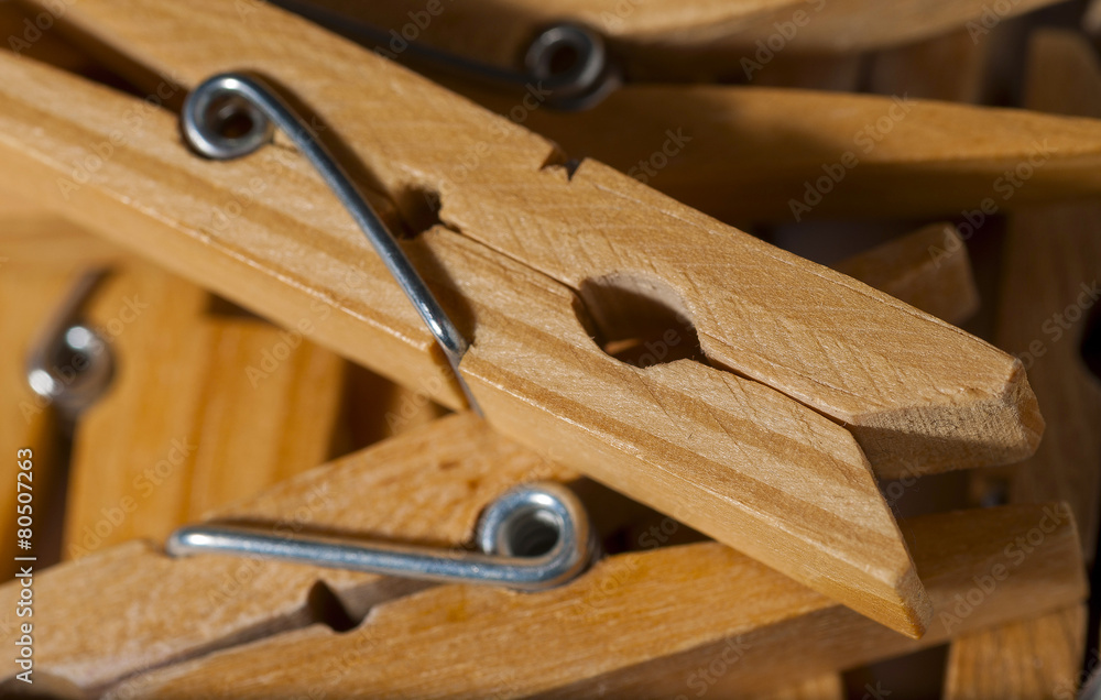 group of wooden clothespins which projects one