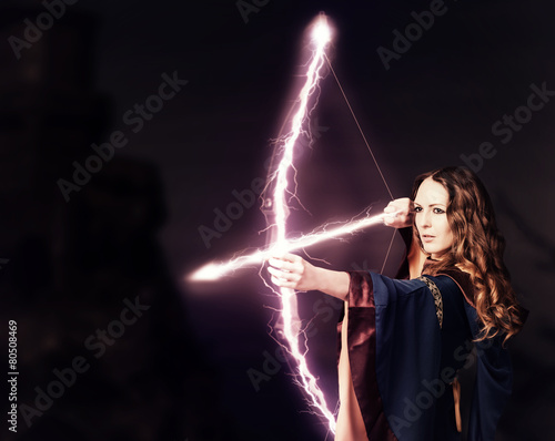 Cuadro en lienzo Beautiful fairy woman archer with a magic bow