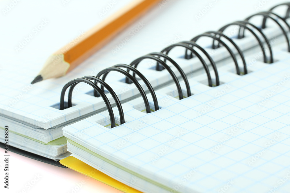 school supplies: notebook and pencil isolated school supplies: notebook and pencil isolated