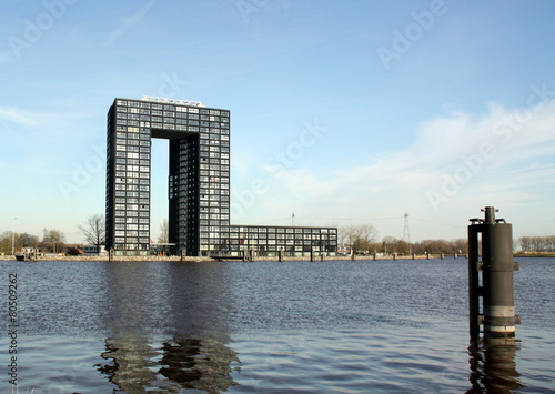 Modern appartment building and mooring posts in Groningen photo