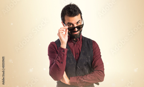 Man wearing waistcoat with sunglasses