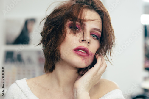 The woman with the smeared lipstick.