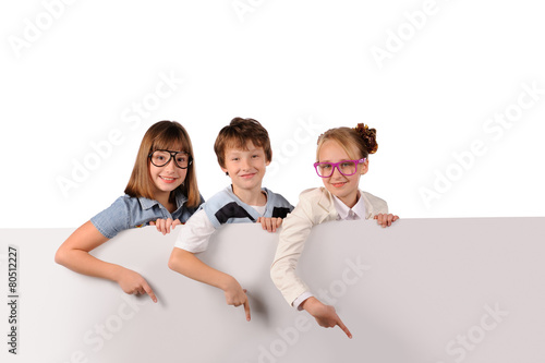 Portrait of happy children with white blank photo