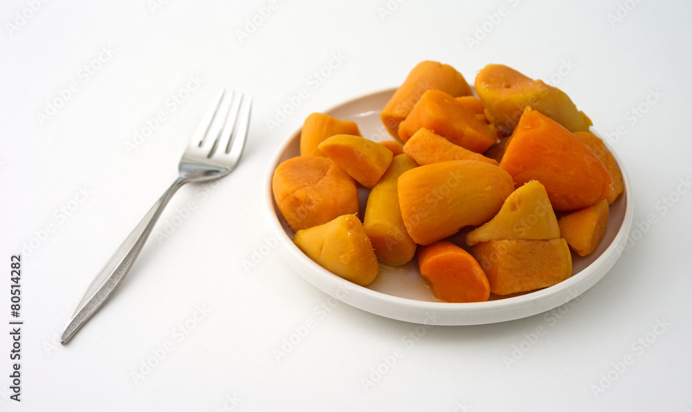 Canned yams on plate with fork Canned yams on plate with fork