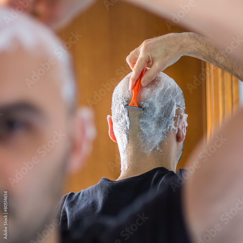 man who shaves his head photo