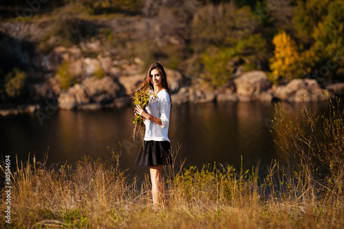 Young woman near lake