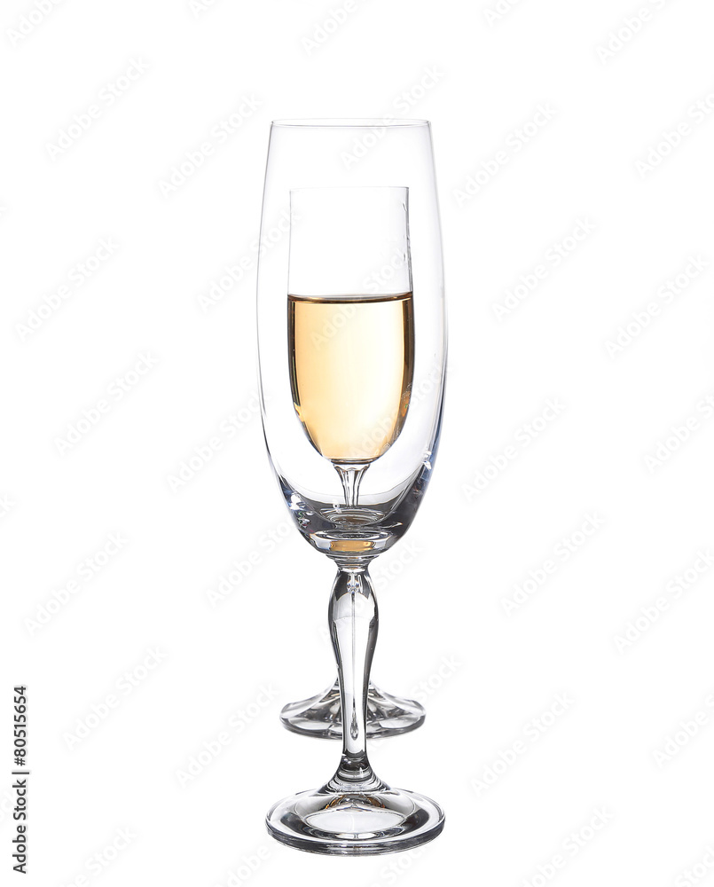 Full and empty champagne glasses with white wine Full and empty champagne glasses with white wine