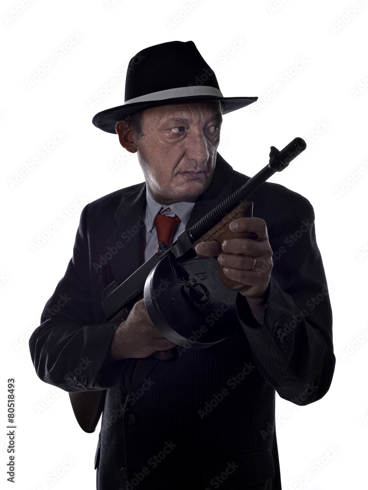 Old style gangster with tommy gun, on white background Old style gangster with tommy gun, on white background