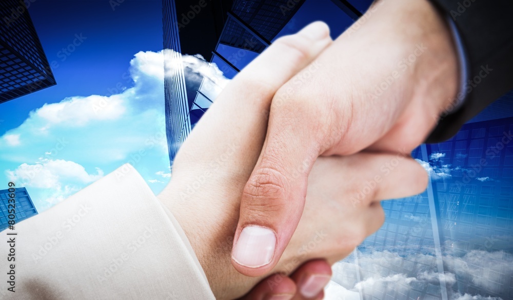 Composite image of close up on new partners shaking hands Composite image of close up on new partners shaking hands