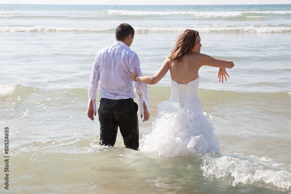 Happy couple just married relaxing on the beac Happy couple just married relaxing on the beac