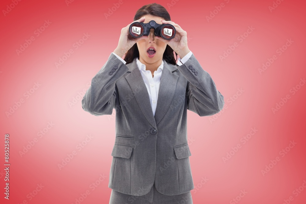 Surprised businesswoman looking through binoculars Surprised businesswoman looking through binoculars