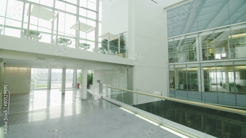 Interior view of modern office building with glass partitions & central atrium photo