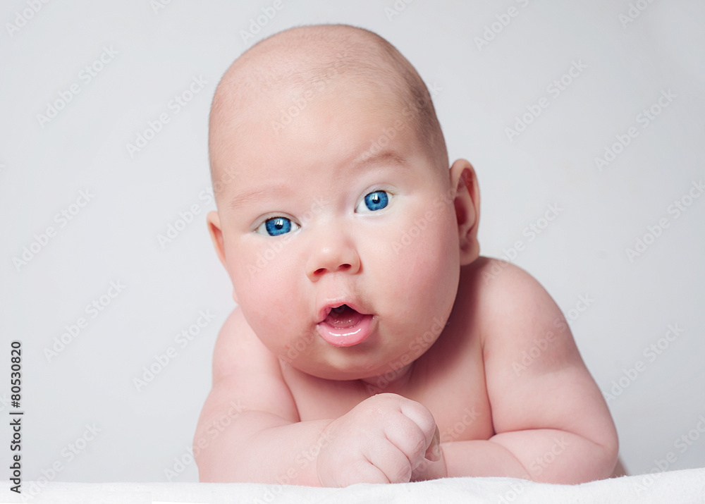 Surprised blue-eyed baby boy looking to camera Surprised blue-eyed baby boy looking to camera