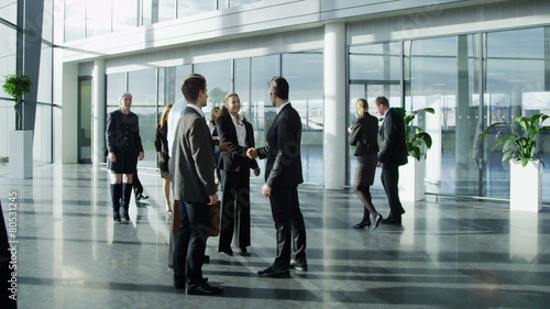 Diverse group of business people in a light and modern office building