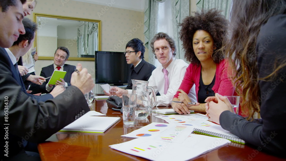 Time lapse of a diverse team of professionals in a boardroom meeting Time lapse of a diverse team of professionals in a boardroom meeting