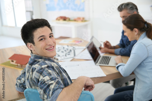Photos Portrait of college boy attending class