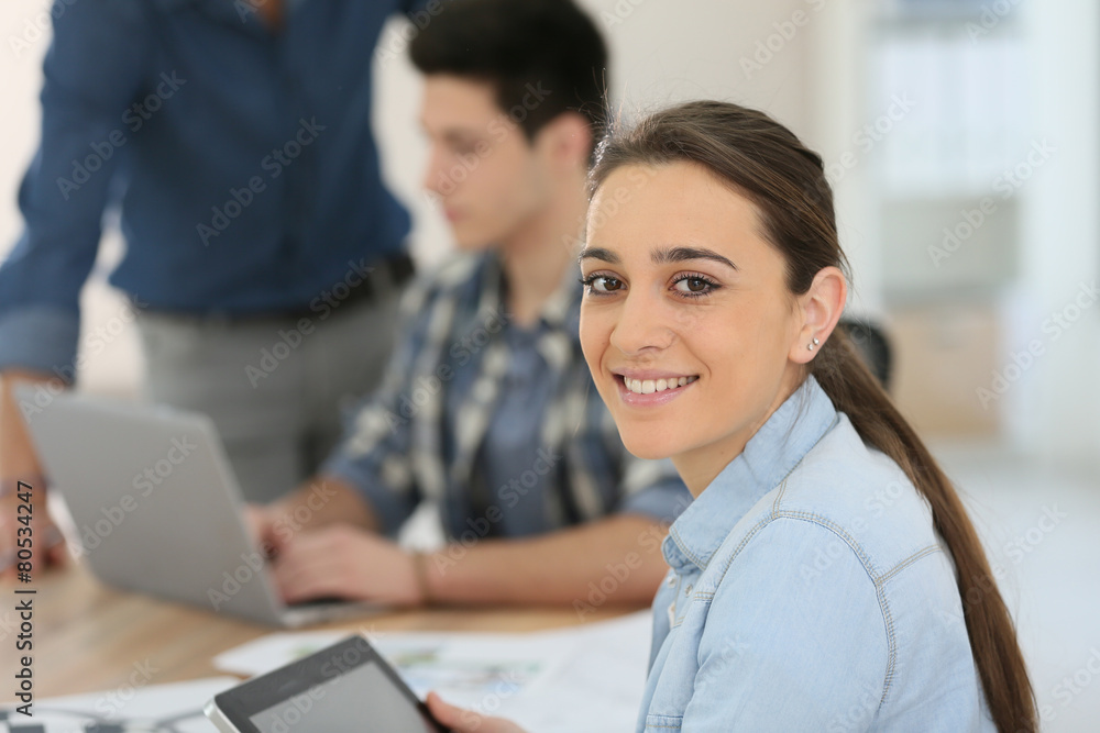Portrait of student girl using digital tablet in class Portrait of student girl using digital tablet in class