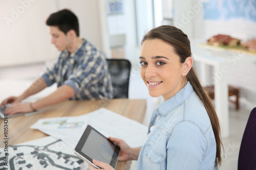 Wallpaper Mural Portrait of student girl using digital tablet in class Torontodigital.ca