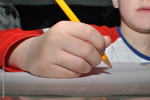 child with pencil