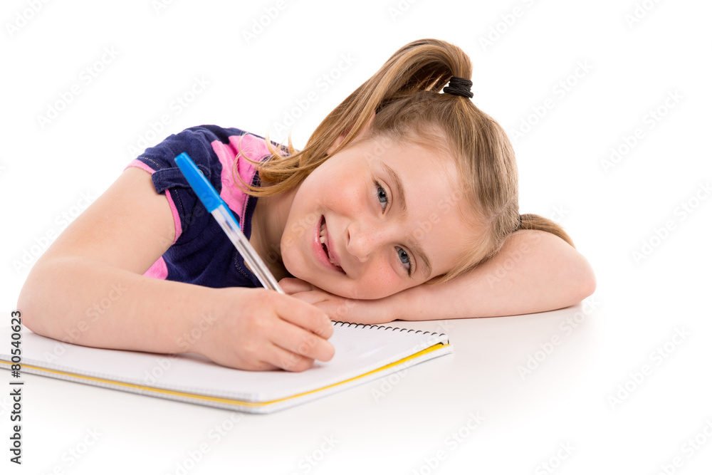 Blond kid girl student with spiral notebook in desk Blond kid girl student with spiral notebook in desk
