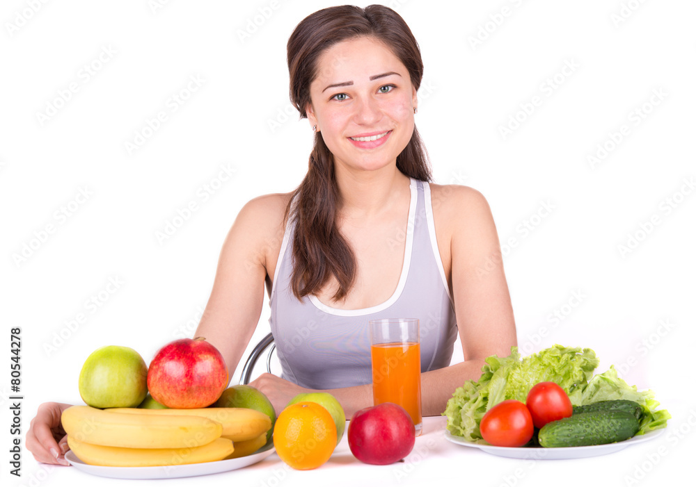 beautiful girl with fruit and vegetables on the table beautiful girl with fruit and vegetables on the table