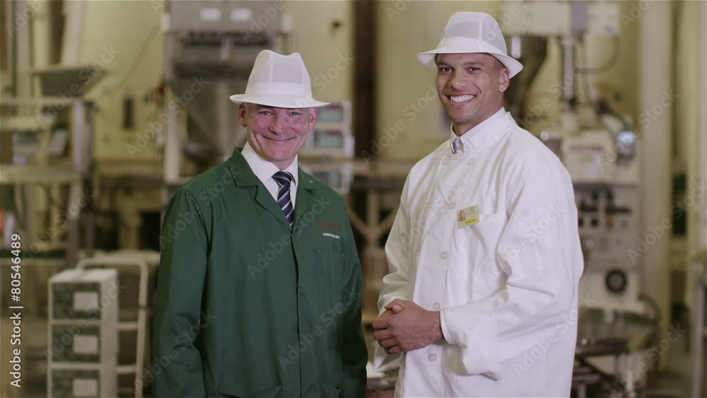 Portrait of friendly smiling factory workers in the food and drink industry Portrait of friendly smiling factory workers in the food and drink industry