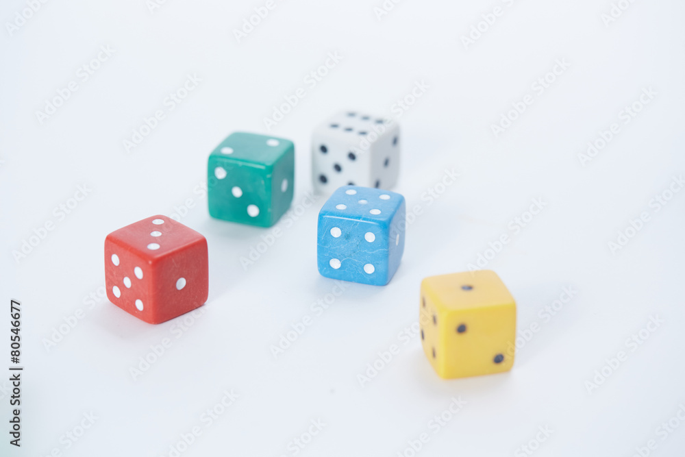 colored playing dice in a chaotic manner on a white background colored playing dice in a chaotic manner on a white background