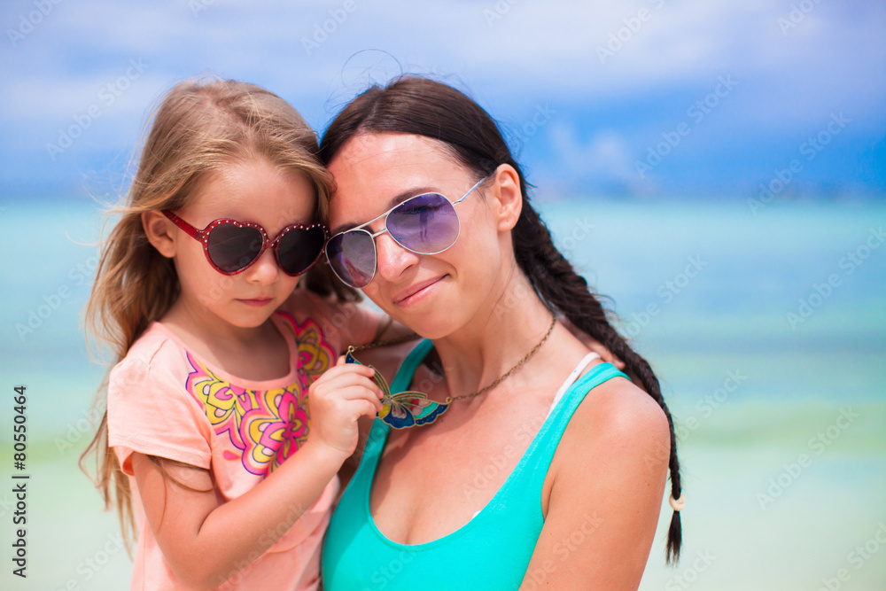 Hppy family of mom and girl during summer beach vacation Hppy family of mom and girl during summer beach vacation