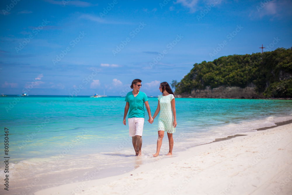 Young happy couple have fun on brach vacation Young happy couple have fun on brach vacation