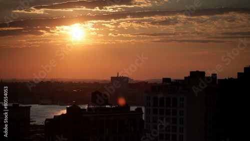 Time lapse cloudscape with the sun setting over the horizon