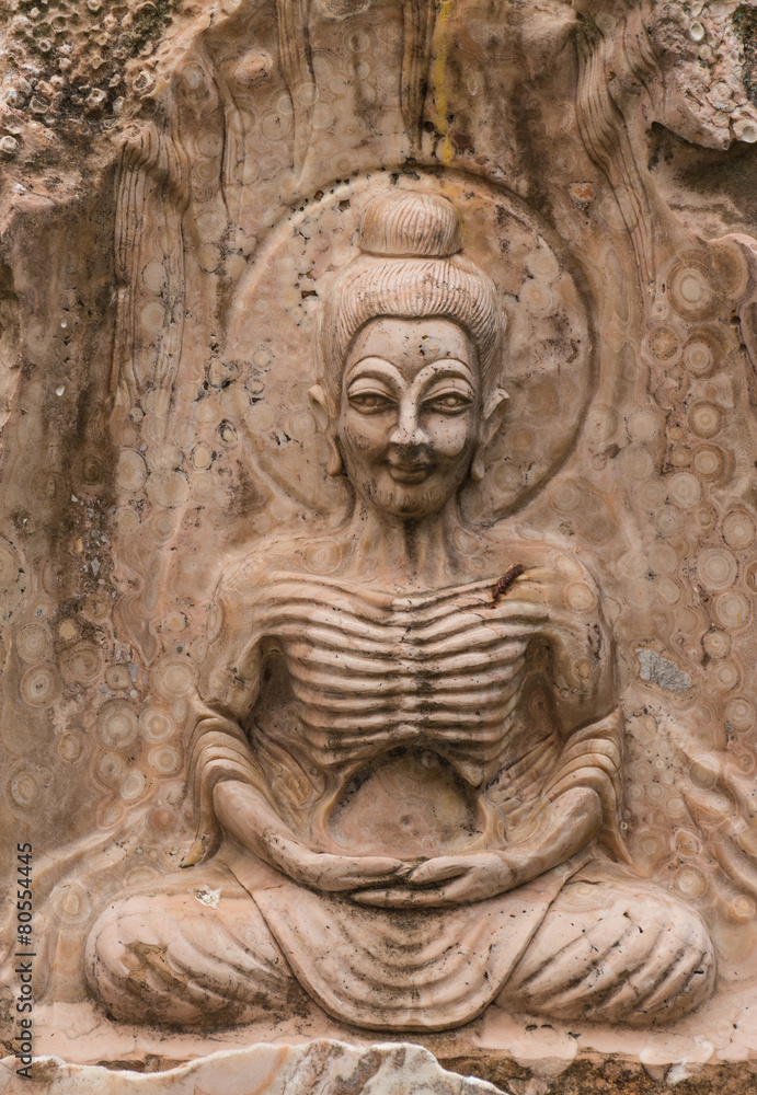 the ancient stone carving for buddha statue