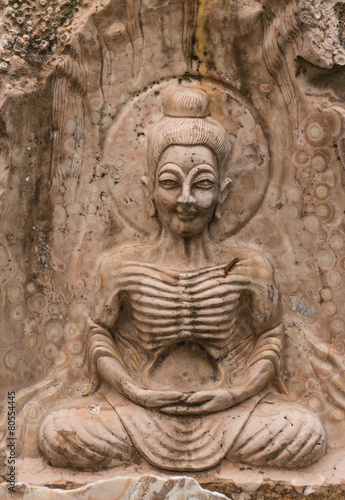 the ancient stone carving for buddha statue