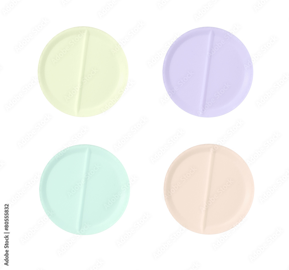 Set of multi-colored medical pill tablet isolated on white