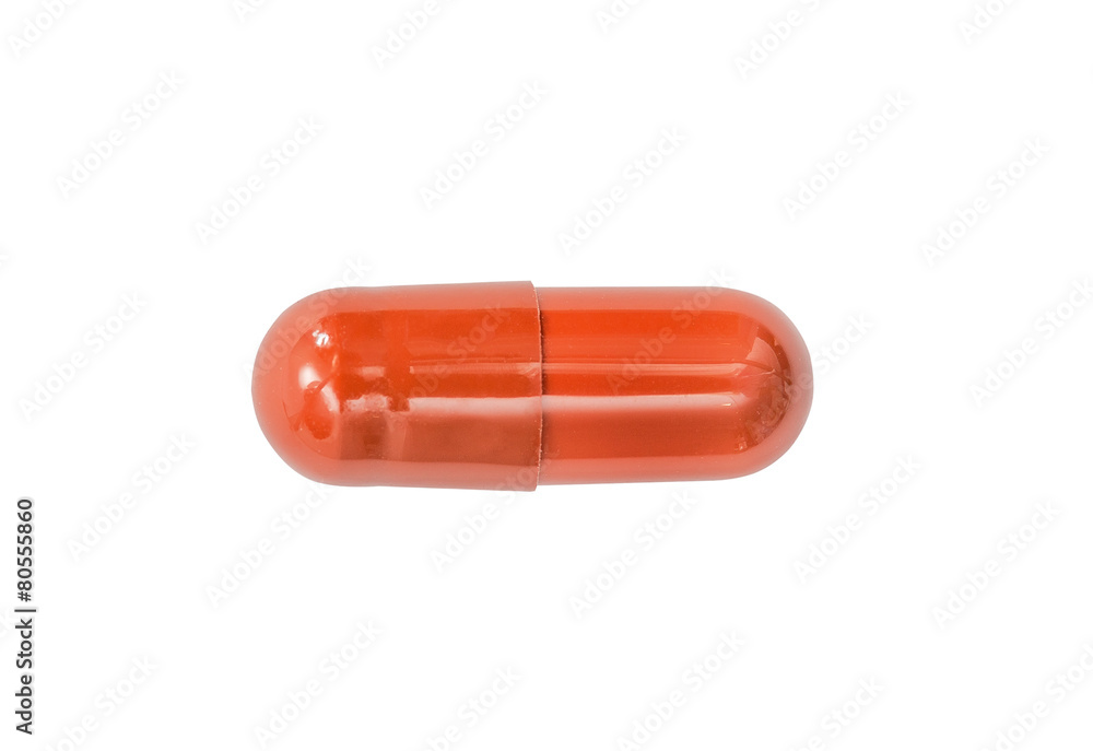 Macro red medical pill tablet isolated on white
