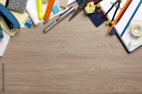 Desk cluttered with office supplies