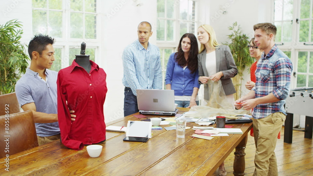 Creative fashion design team brainstorming in a business meeting Creative fashion design team brainstorming in a business meeting
