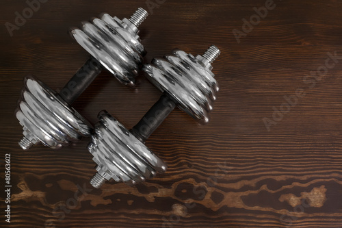 dumbbells on wooden table