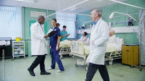 Medical staff working together and taking care of patients on a hospital ward