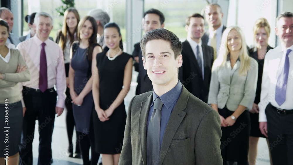 Attractive diverse business team in a light modern office building Attractive diverse business team in a light modern office building