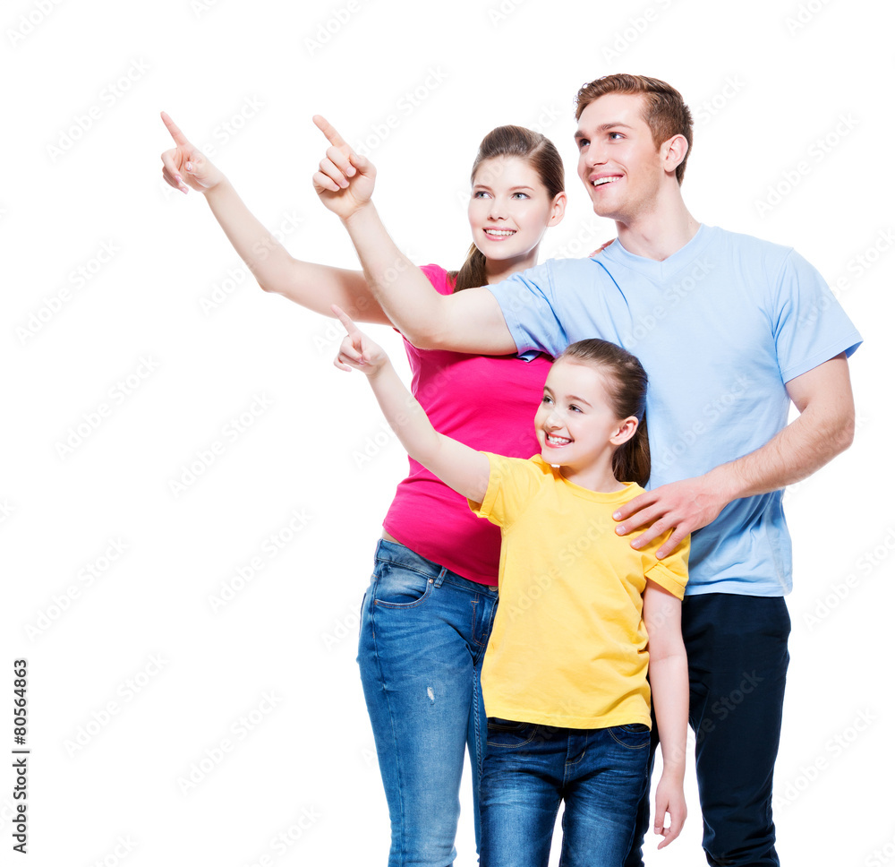 Happy young family with kid pointing finger up. Happy young family with kid pointing finger up.